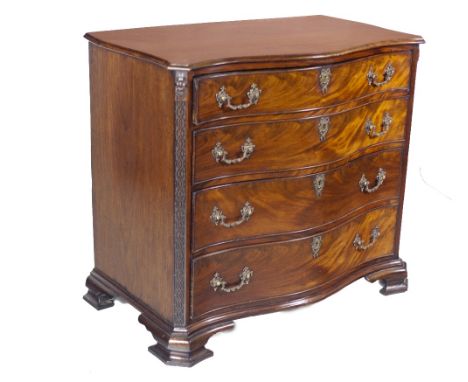 A fine quality early George III serpentine fronted mahogany Dressing Chest, c. 1760, the figured moulded top over a brushing 