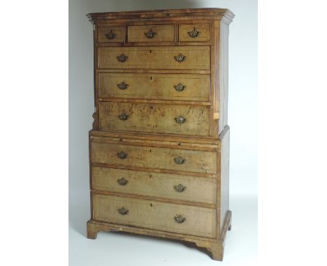 A very fine early 18th Century inlaid walnut Chest on Chest, the moulded top over three short and three long drawers with ree