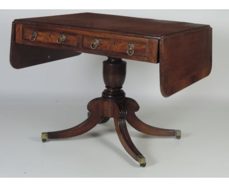 An attractive George III mahogany Sofa Table, with rosewood crossbanded top over two frieze drawers and two blank drawers on 