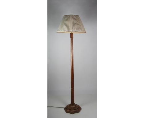 A carved oak Lamp Standard, by Robert Mouseman Thompson. (1)