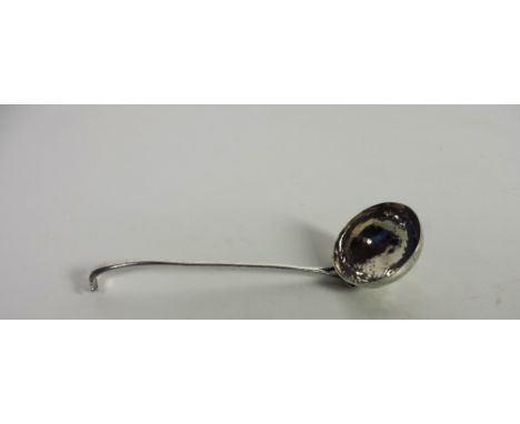 An unusual Art Nouveau style early 20th Century Irish silver Soup Ladle, with decorated pierced handle and hand beaten bowl, 