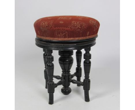 An ebonised circular Piano Stool, with telescopic seat. (1)