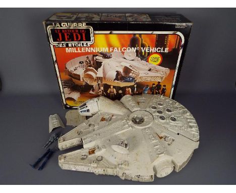 Star Wars - A boxed, vintage, Millennium Falcon Vehicle by Kenner, with accessories, contained in Palitoy box. Model appears 