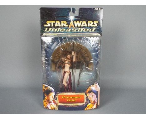 Star Wars - Hasbro - An 8" Princess Leia figure from the Unleashed series dated 2002. # 84936. The figure is still sealed so 