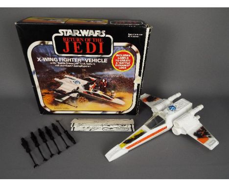 Star Wars - A boxed, vintage Kenner X Wing Fighter Vehicle with Battle Damaged look feature, with six laser cannons, instruct