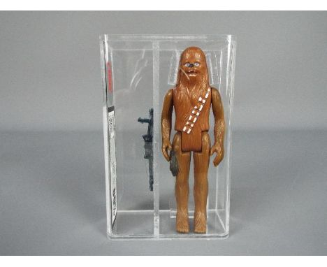 Star Wars - A loose vintage and graded Star Wars 'A New Hope' 3 3/4 action figure 'Chewbacca'. The figure is UK Graded at 80%