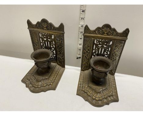 A pair of Victorian brass candlestick holders