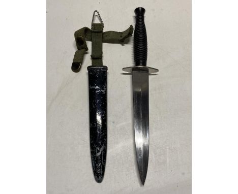 A French Commando fighting knife (Foreign Legion) in an adapted scabbard  UK postage only.