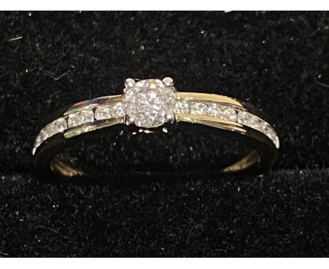 A 9ct gold and diamond solitaire ring with diamond accents to the shoulders size P1/2 2.07g