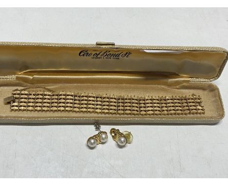 A vintage Trifari bracelet and earring set