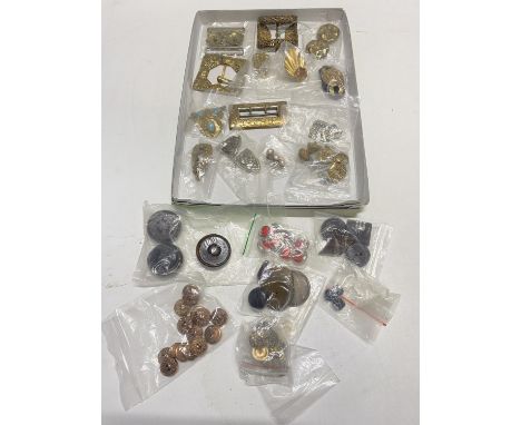 A selection of antique and vintage buckles, clips and buttons