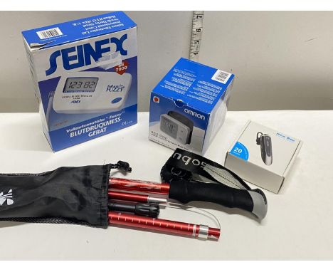 Two boxed digital blood pressure monitors, Bluetooth headset and a collapsible walking stick (untested)