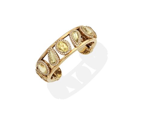 ZILLA: CITRINE AND DIAMOND BANGLEThe openwork torque bangle set with oval, pear and marquise-cut citrines and brilliant-cut d