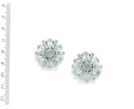 AQUAMARINE CLIP BROOCHES, CIRCA 1935Of floral design, each set with pear-shaped and step-cut aquamarines, accented by collet-
