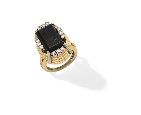 TOURMALINE AND DIAMOND DRESS RING, CIRCA 1945The rectangular step-cut tourmaline within a reeded mount, accented by single-cu
