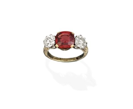 RUBY AND DIAMOND THREE-STONE RINGThe cushion-shaped ruby, between old brilliant-cut diamonds, diamonds approx. 1.80cts total,