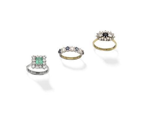 THREE DIAMOND AND GEM-SET RINGS1st: The step-cut emerald within a surround of brilliant-cut diamonds, 2nd: The circular-cut s