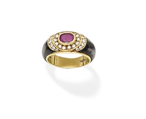 RUBY AND DIAMOND DRESS RINGThe oval-cut ruby within a brilliant-cut diamond surround, the mount of blackened metal, ring size