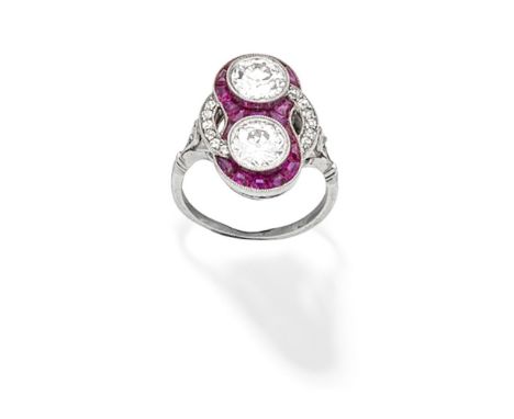 ART DECO DIAMOND AND RUBY RING, CIRCA 1930The two old brilliant-cut diamonds within a surround of calibré-cut rubies and cush