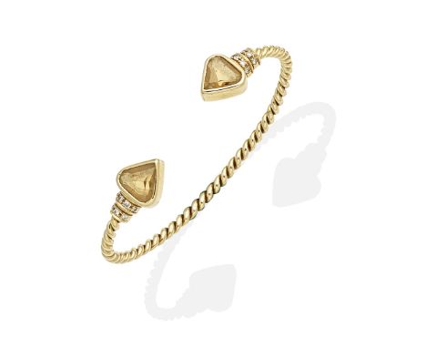 CITRINE AND DIAMOND-SET BANGLEThe ropetwist torque bangle, terminating in heart-shaped citrines and brilliant-cut diamonds, i