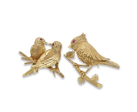 TWO RUBY-SET BIRD BROOCHESComprising a pair of lovebirds and a European crested tit, each with a circular-cut ruby eye, Frenc