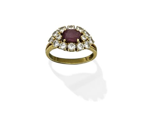 RUBY AND DIAMOND CLUSTER RINGThe oval-cut ruby within a brilliant-cut diamond surround,  diamonds approx. 1.20cts total, ring