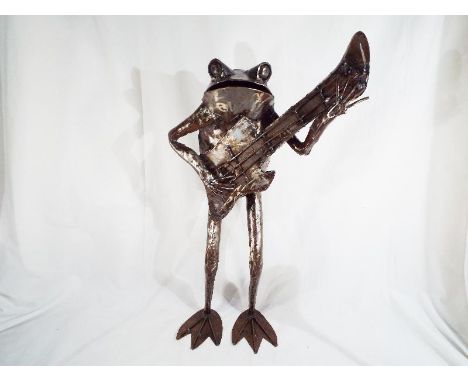 Modern Art - a hand-made metallic sculpture depicting a Frog playing a guitar, 68 cm (high) - Est £80 - £120
