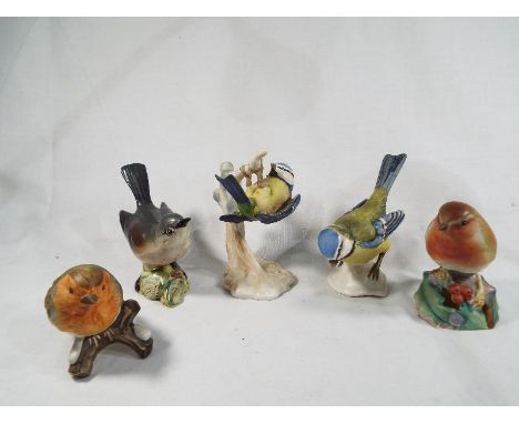 A collection of five ceramic birds to include a Goebel robin model No. 380, a W.Goebel blue tit, a Goebel blue titmouse, a Be