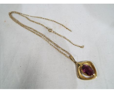 A lady's 9ct gold necklace with 9ct gold pendant set with amethyst centre stone, approx weight 6.99grams (all in) Est £50 - £