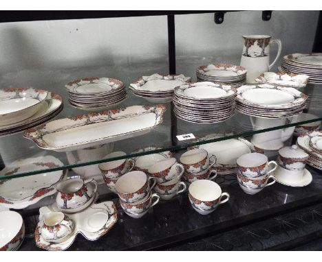 An early 20th century hand-painted tea / dinner service by Crown Ducal decorated in the Orange Tree pattern comprising approx