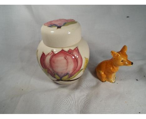 A Moorcroft lidded ginger jar depicting magnolias on a cream ground approximately 11 cm (h) (AF) together with a Goebel cruet