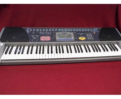 A Casio WK1200 with music shelf - £30 - £50