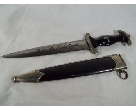 World War Two (WWII) - a model 1933 SS Service Dagger, the well preserved blade bearing etched motto and maker's marks, with 