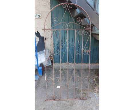 An 81cm wrought iron garden gate with dome-top and scroll decoration