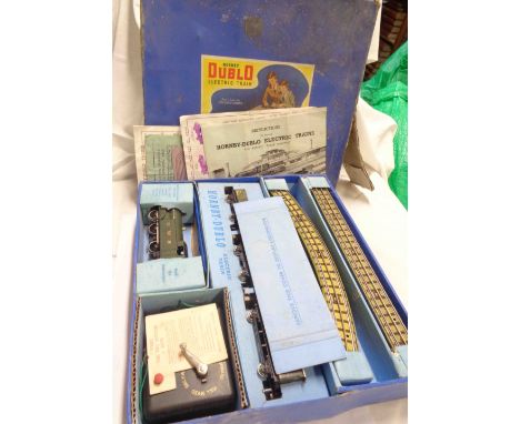 A boxed Hornby Dublo 00 gauge electric train set (EDG7) with GWR livery green tin-plate tank engine, three goods wagons, quan