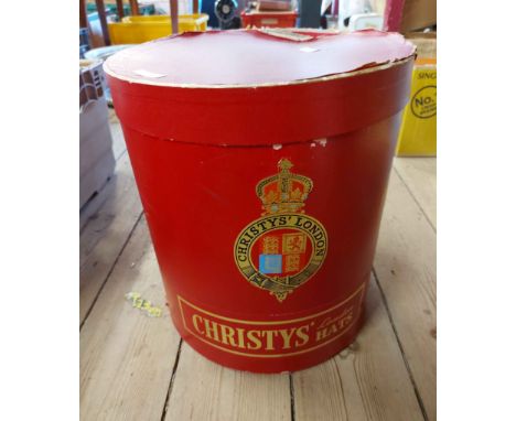 A vintage oval hat box marked for Christy's, London Hats with red leather effect paper covering and gilt lettering