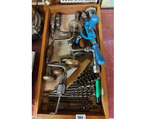 A wooden tray containing a quantity of brace and bits and a vintage hand drill, etc.