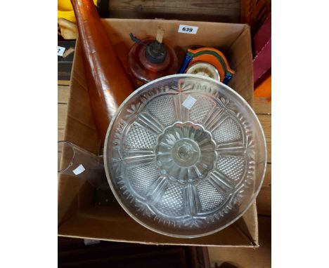 A box containing a small quantity of collectable ceramic and glass items including plates, clock, oil lamp, etc.