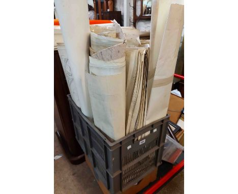 A crate containing a collection of old Ordnance Survey and other rolled maps and plans - mainly GB locations