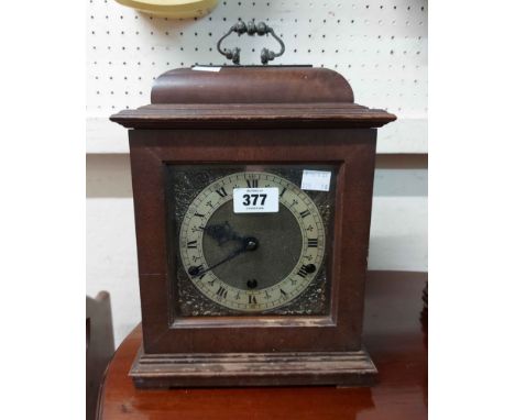 A 20th Century stained walnut cased bracket clock with Perivale (British) eight day chiming movement