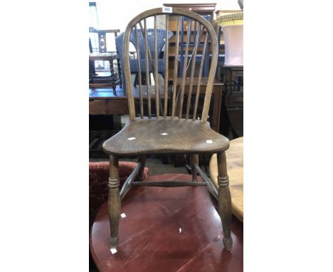 Two similar old hoop stick back kitchen chairs, both with moulded solid elm seats