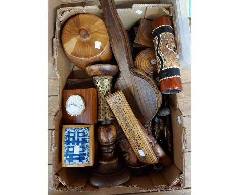 A box containing a quantity of assorted wooden items including African carved figures, boxes, Wills's Star Cigarettes adverti