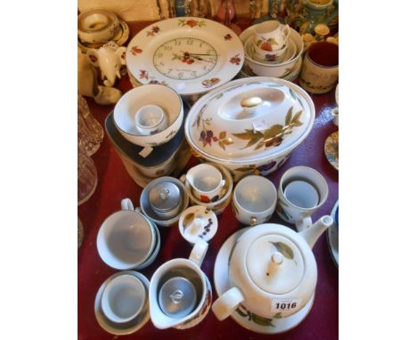 A large quantity of Royal Worcester Evesham oven-to-table ware including flan dishes, lidded casserole, teapot, clock, cereal