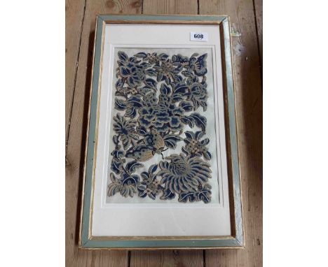 An antique cutwork embroidered panel depicting butterflies amidst flowers and foliage with gold thread edging, mounted on pap