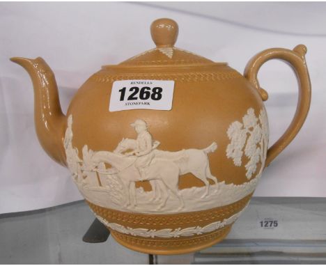 A 19th Century Copeland teapot with applied jasper sprigging depicting a hunting scene on a brown smear glaze ground