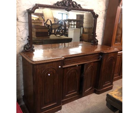 A 1.85m Victorian mahogany mirror backed sideboard with pierced scroll pediment and shaped plate over central blind frieze dr