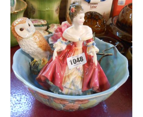 A Royal Doulton bone china figurine Southern Belle HN2229, a Beswick figurine depicting a barn owl, an Art Deco style Melbawa