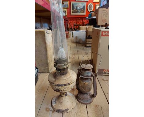 A box containing an old Aladdin oil lamp with glass chimney - sold with a hurricane lamp