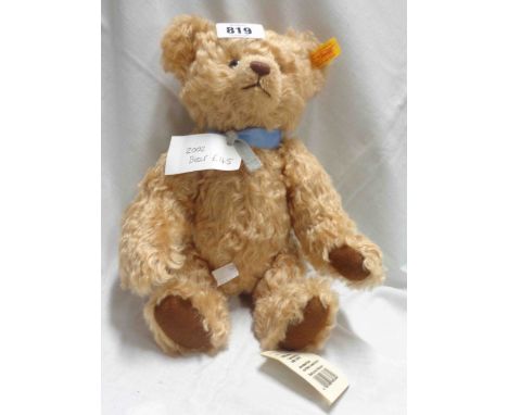 A limited edition Steiff 2002 bear with original button and medal