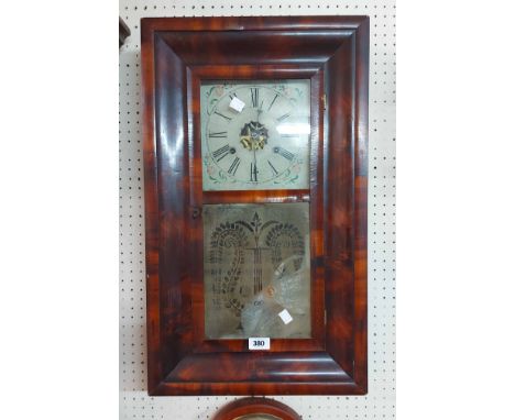 An antique mahogany cased American wall clock with etched glazed panel door and E.N. Welch thirty hour twin weight driven gon